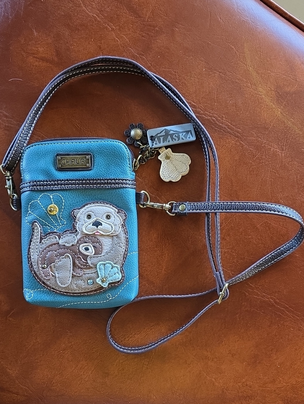 Chala Teal Otter Crossbody Phone Bag with Brown Trim and Alaska Charm